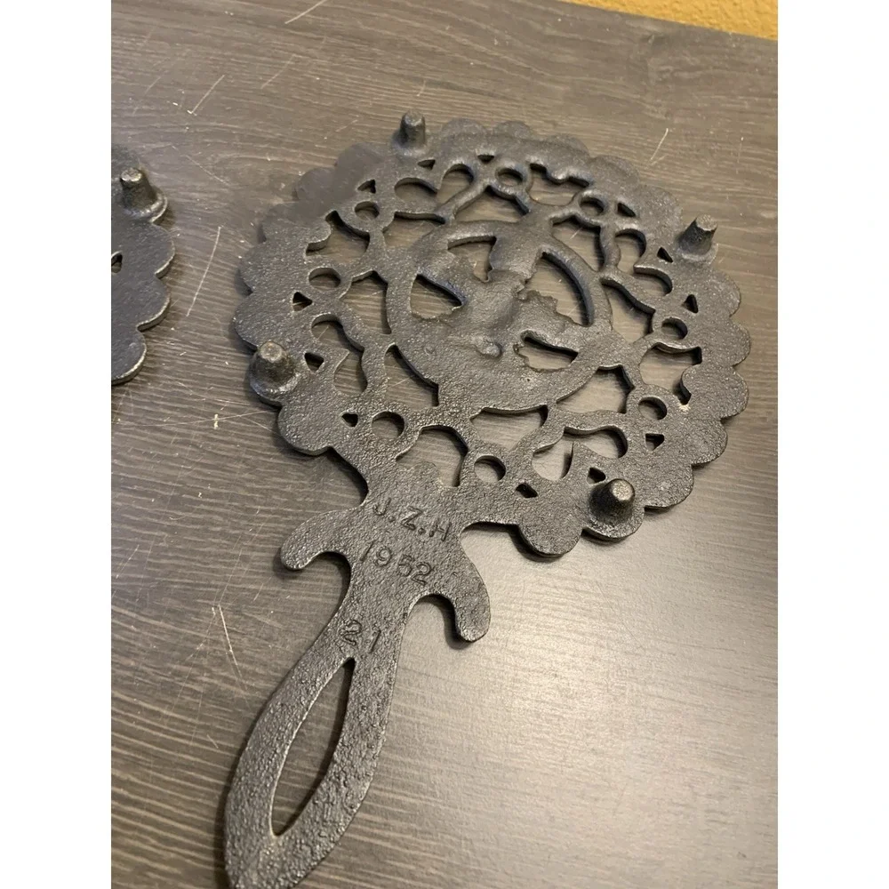 Two Fancy Vintage Cast Iron Trivets Black J.Z.H Amish Boy Girl 1952